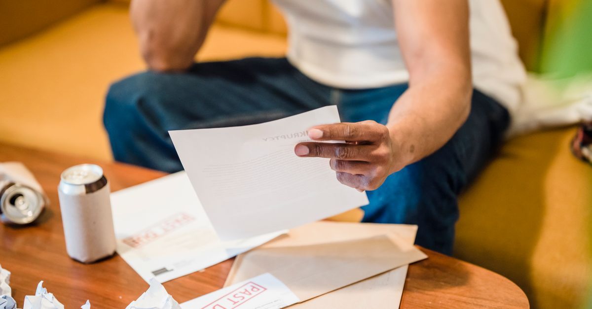 Two people reading through a printed statement together