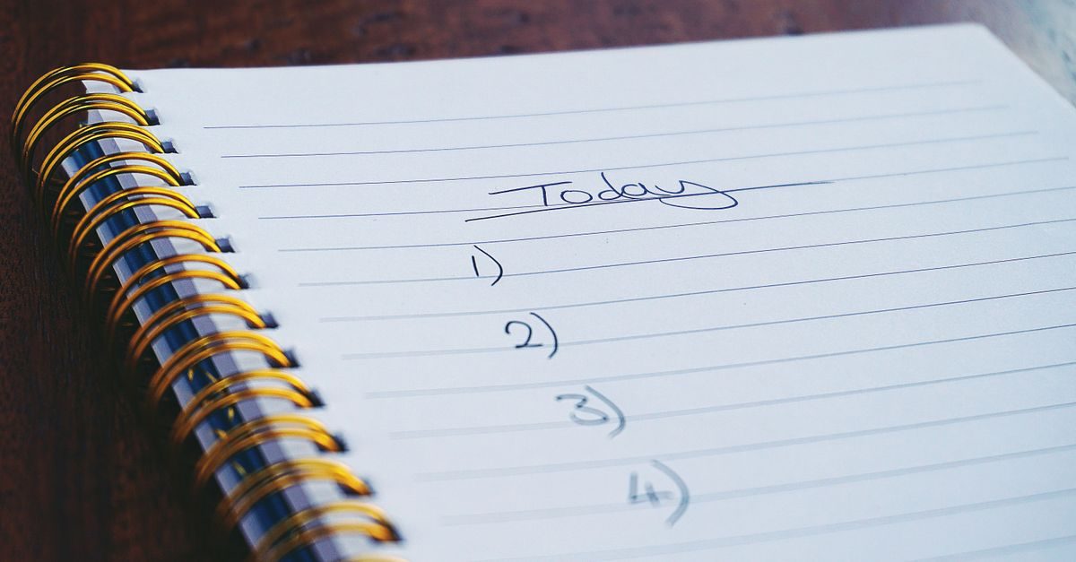A spiral notebook with a handwritten numbered list